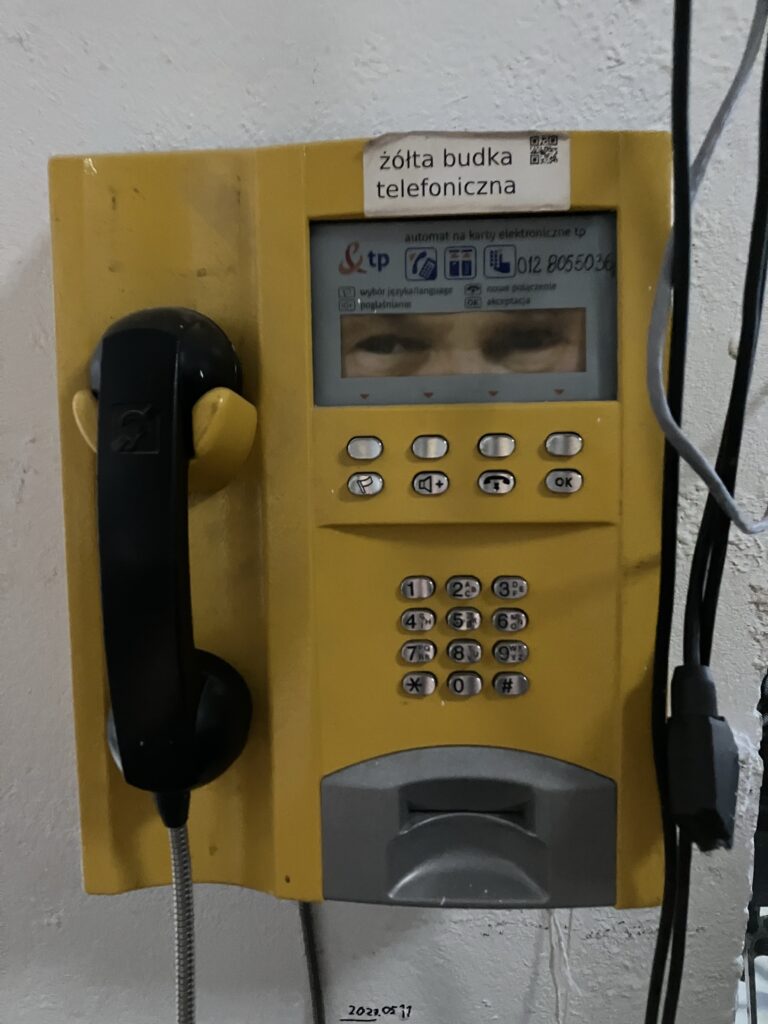 an old card telephone with which you can call "the Pope". On a display are the eyes of the Pope staring at you while you hear a random sentence of the Pope in Polish after you have dialled the corresponding number.